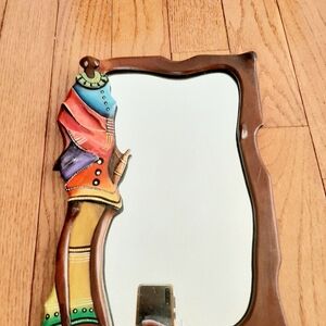 Hand Carved and painted wooden framed mirror.